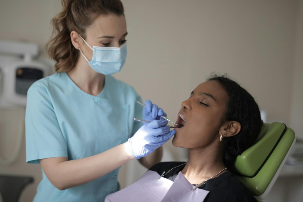 Dentist examining patient during dental check-up