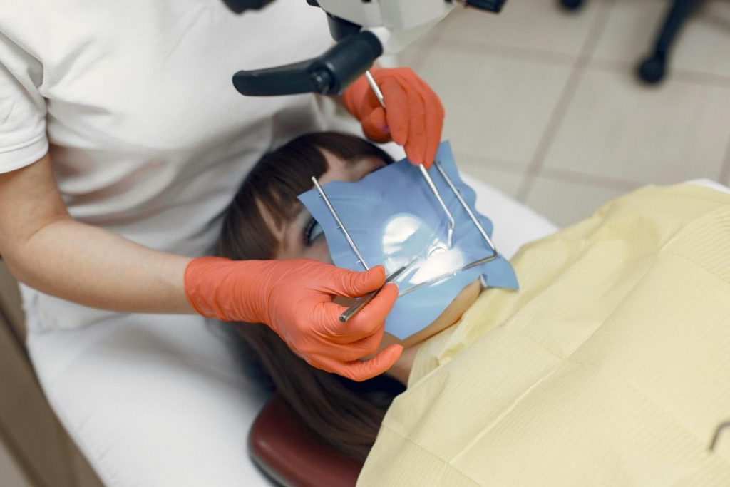 Dental procedure with a dentist using equipment in a clinic